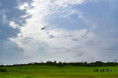 Low angle view of airplane flying in sky