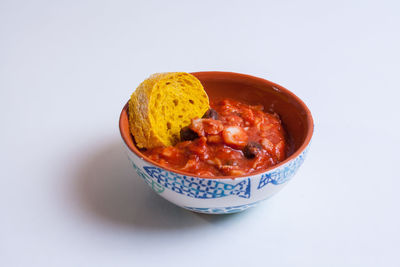 Close-up of soup in bowl against white background