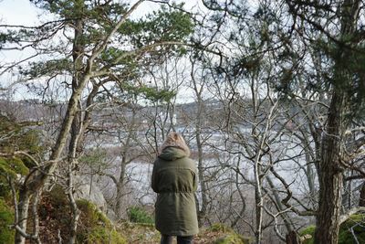 Low angle view of statue against bare trees