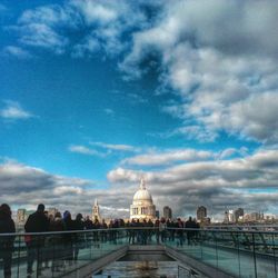 Building exterior against cloudy sky