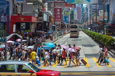 People crossing road in city