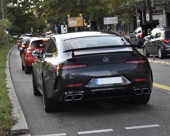 Cars parked on road in city