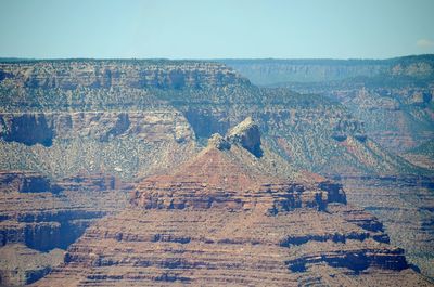 Scenic view of rocky mountains against clear sky at grand canyon national park