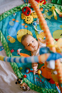 Portrait of cute baby girl with toy