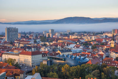 Cityscape of graz from shlossberg hill, graz, styria region, austria, in autumn, at sunrise