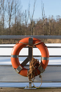 Close-up of rope tied on boat against river