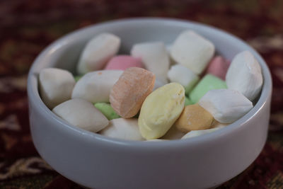 High angle view of candies in bowl on table