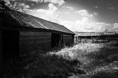 Abandoned built structure on field against sky