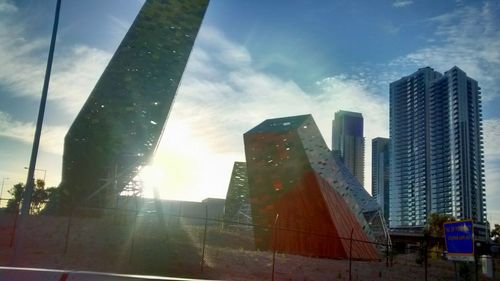 Low angle view of skyscrapers against sky