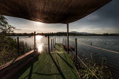 Scenic view of lake against sky during sunset