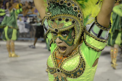 Close-up of woman in costume dancing at carnival