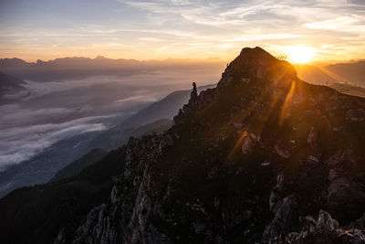 Scenic view of mountains against sky during sunset