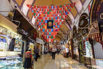 People walking at market stall in city