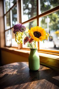 Close-up of vase on table against window