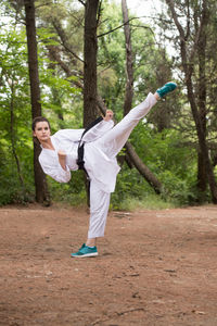 Full length of woman standing on field