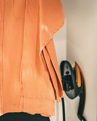 Close-up of clothes on wall at home
