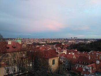 Houses in city against sky