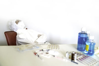 Close-up of objects on table against white background