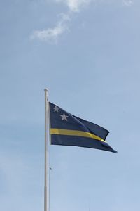 Low angle view of flag against sky