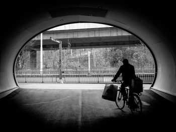 Rear view of person riding bicycle