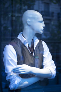 White image of man with umbrella on window