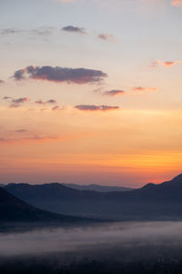 Scenic view of silhouette mountain against sky during sunset