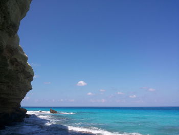 Scenic view of sea against clear blue sky