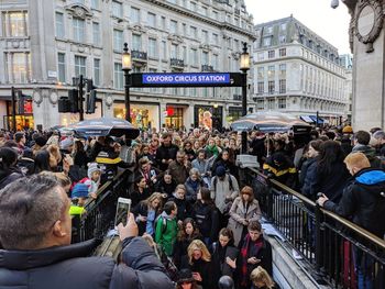 Crowd on street in city