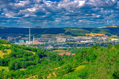 Aerial view of city and buildings against sky