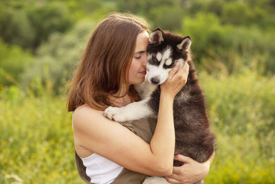 Portrait of young woman with dog