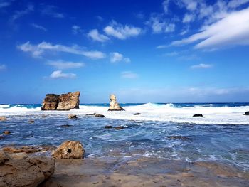 Scenic view of sea against blue sky