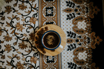 High angle view of coffee cup on table