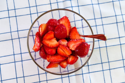 High angle view of chopped fruits in bowl on table