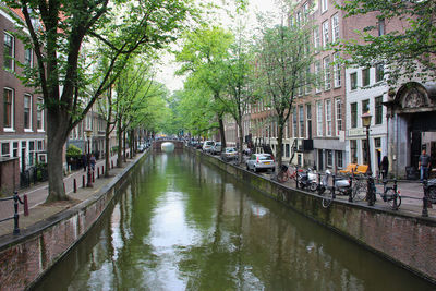 Canal amidst buildings in city