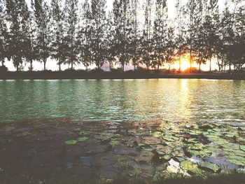 Scenic view of lake against sky during sunset