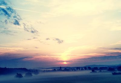 Scenic view of silhouette landscape against sky during sunset