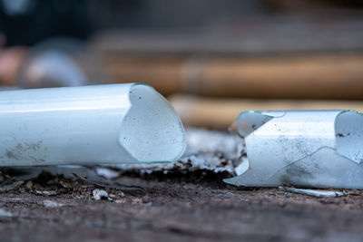 Close-up of broken glass on wood