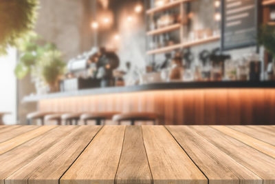 Close-up of wooden table at restaurant