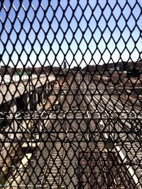 Close-up of chainlink fence against clear sky