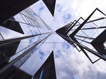 Low angle view of building against cloudy sky