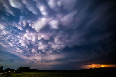 Scenic view of dramatic sky over land