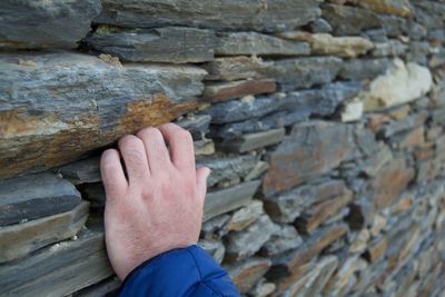 Close-up of hand on rock