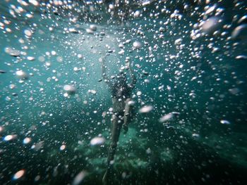 Full length of woman swimming in sea