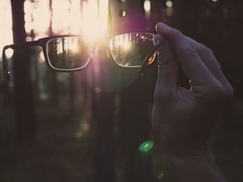 Close-up of hand holding glasses
