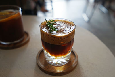 Close up iced black coffee on wooden table