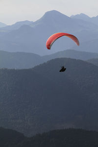 Paragliding in front of alpine panorama 