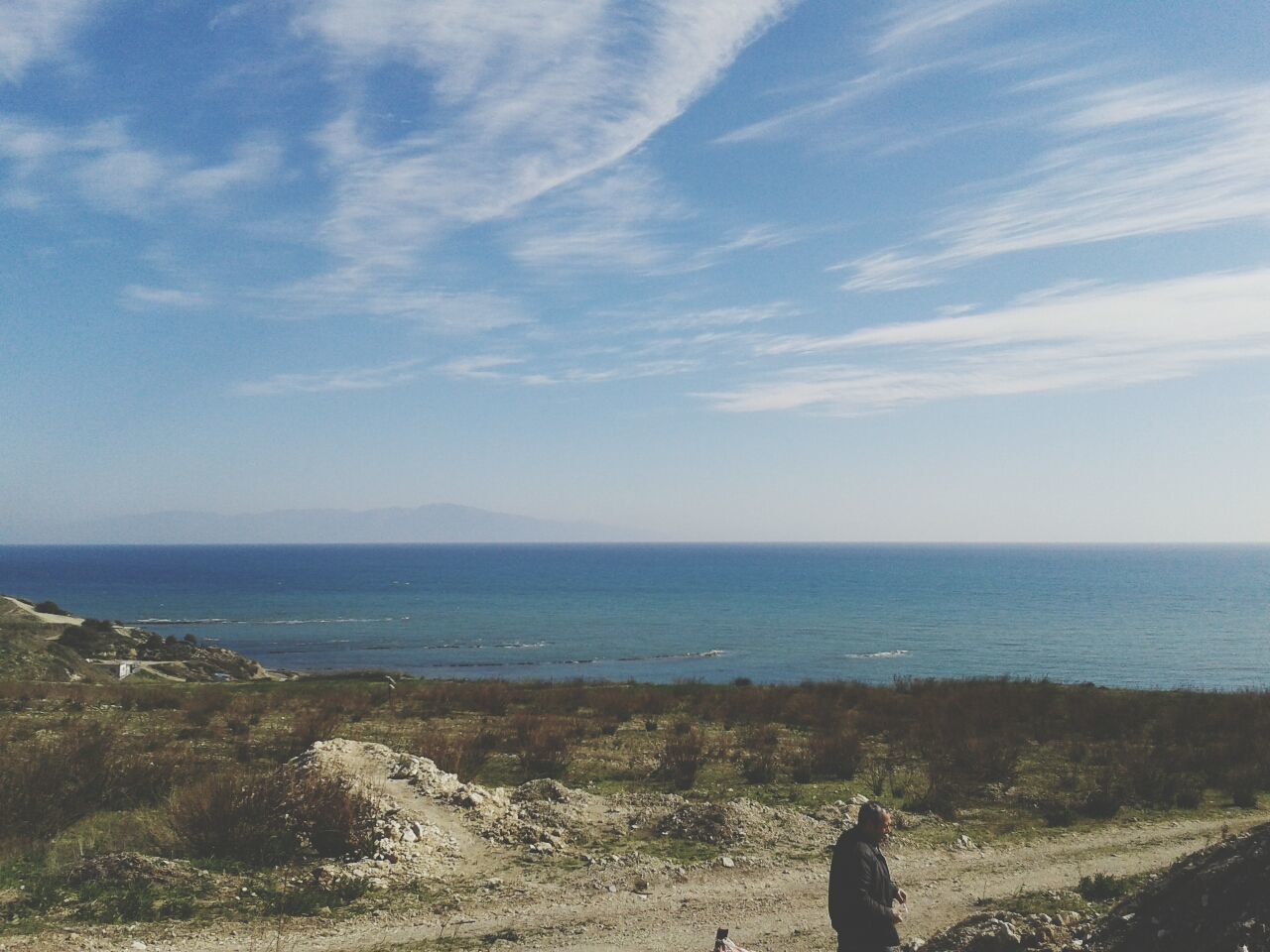 sea, horizon over water, sky, water, beach, scenics, tranquil scene, tranquility, beauty in nature, shore, nature, lifestyles, leisure activity, cloud - sky, blue, idyllic, men, standing