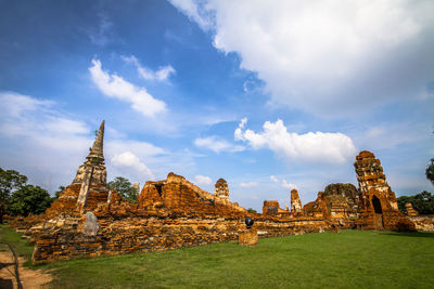 Old temple against cloudy sky