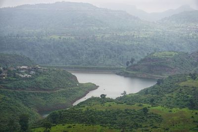 High angle view of river amidst mountains