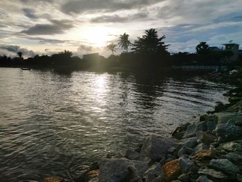 Scenic view of lake against sky during sunset